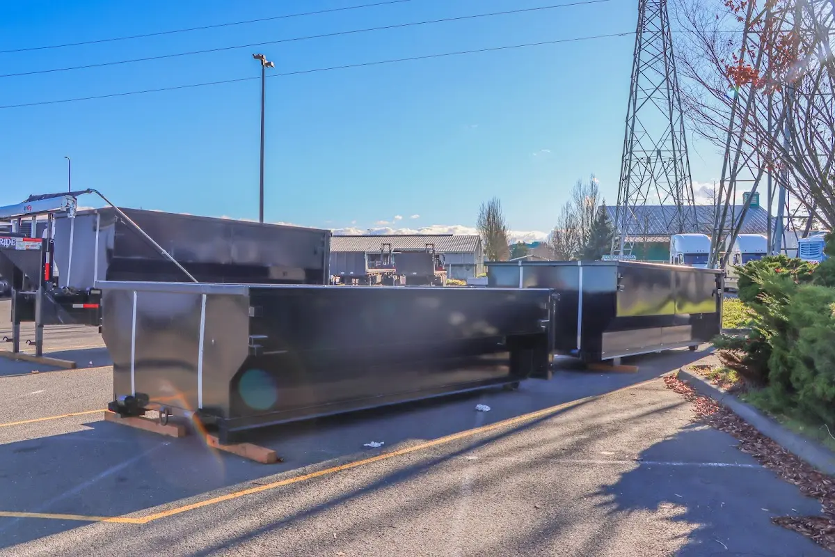 Roll-off dumpster ready for waste disposal at job site for 2 Yard Dumpster Rental in Olyphant
